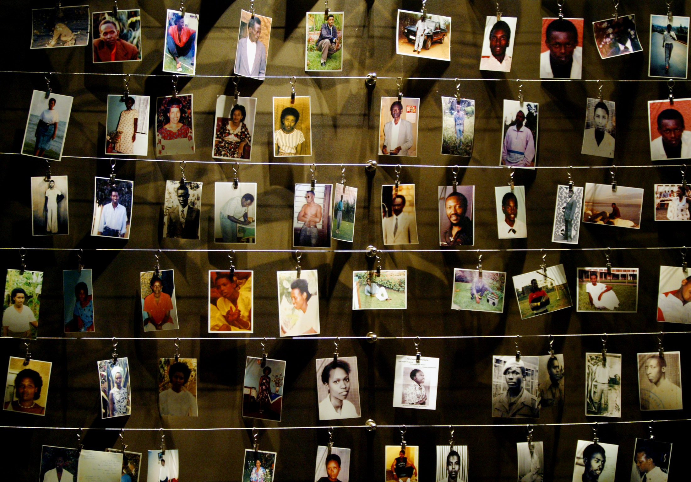 Pictures of victims of Rwanda's 1994 genocide, in which 800,000 Tutsi and politically moderate Hutus died, are installed on a wall inside the Gisozi memorial in Kigali on April 5, 2004. Source: Radu Sigheti/Reuters.