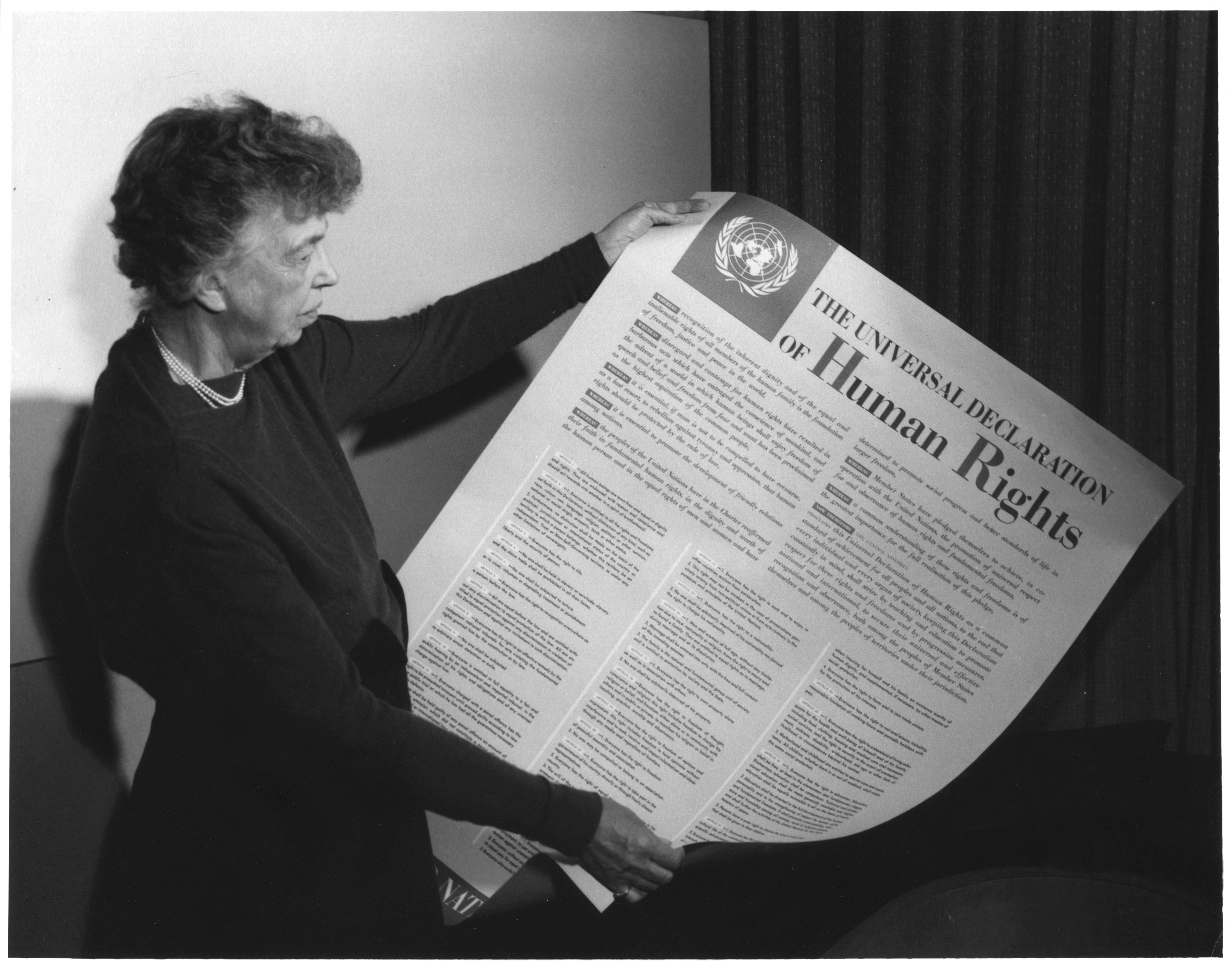 Eleanor Roosevelt holds a poster of the Universal Declaration of Human Rights in Lake Success, New York, in November 1949. Source: Franklin D. Roosevelt Presidential Library and Museum.