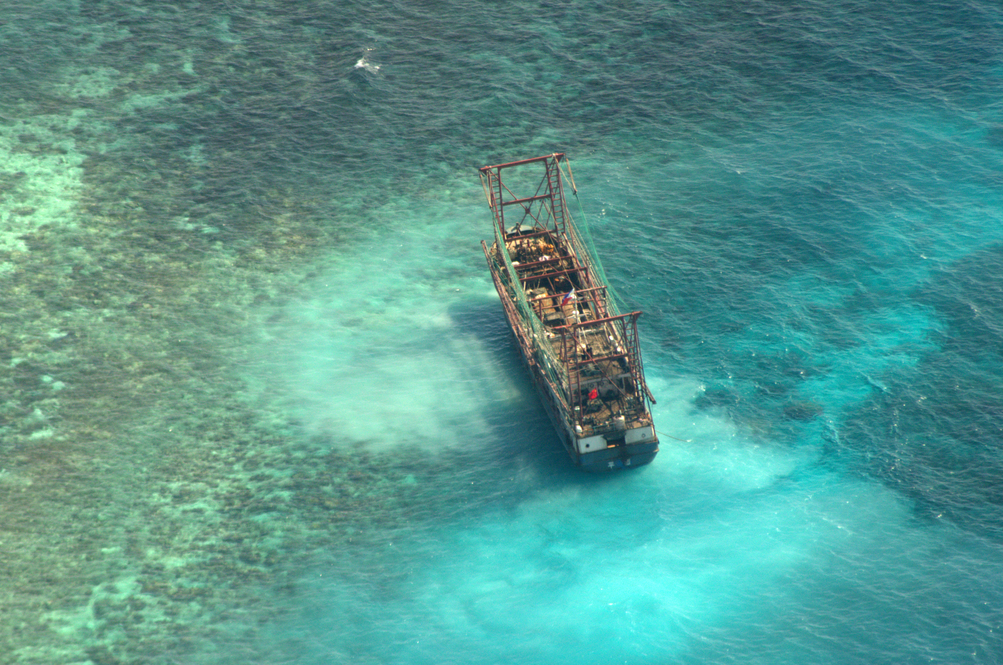 A Chinese fishing vessel that ran aground in Tubbataha Reef, a UNESCO World Heritage site, on Monday is pictured in Palawan Province, west of Manila, Philippines, on April 10, 2013. Source: Philippines Naval Forces West via Reuters.