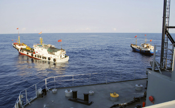 Two Chinese trawlers stop directly in front of the military Sealift Command ocean surveillance ship USNS Impeccable in South China Sea