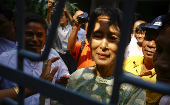 Myanmar’s pro-democracy leader Suu Kyi is greeted by supporters at her National League for Democracy’s party headquarters in Yangon