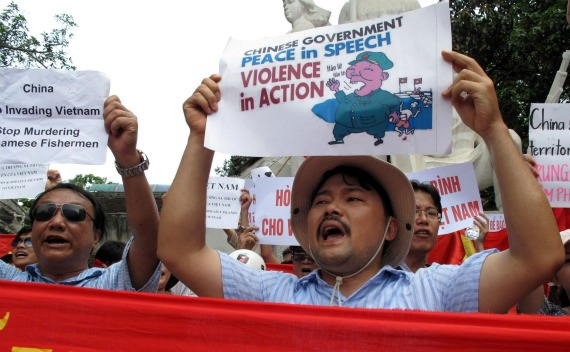 Protesters march with banners and placards during an anti-China demonstration on a street in Hanoi on June 19, 2011. Several dozen Vietnamese protested in front of the Chinese embassy and marched through Hanoi for the third Sunday running after Beijing sent one of its biggest maritime patrol ships into the disputed waters of the South China Sea.