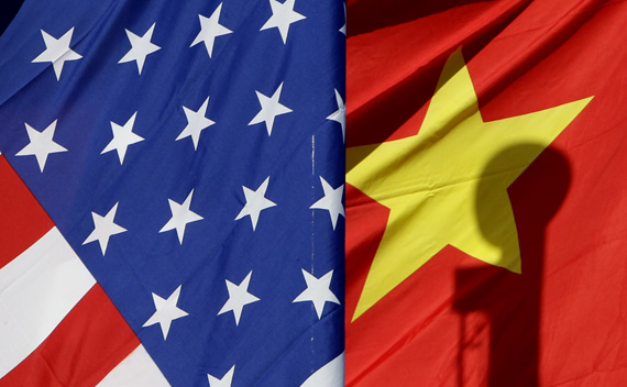 National flags of the U.S. and China are seen in front of an international hotel in Beijing