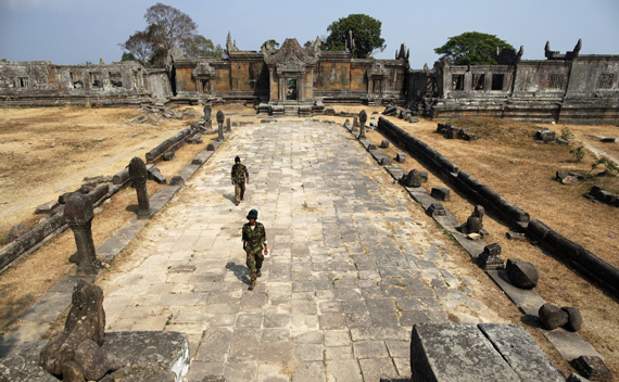 Cambodian soldiers walk at the 11th-century Preah Vihear temple on the border between Thailand and Cambodia February 9, 2011.