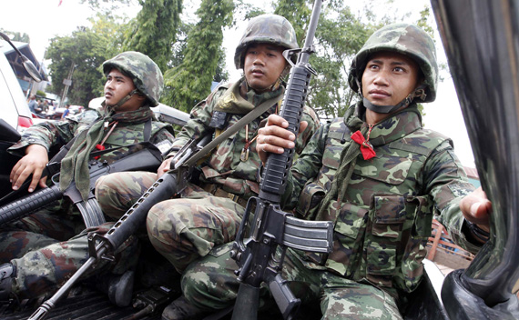 Thai soldiers are seen during a visit by Thai Prime Minister Abhisit Vejjajiva, following armed clashes on a disputed border area between Cambodia and Thailand, at a makeshift camp in Surin province, 30 km (19 miles) from the Thai-Cambodia border, April 27, 2011.