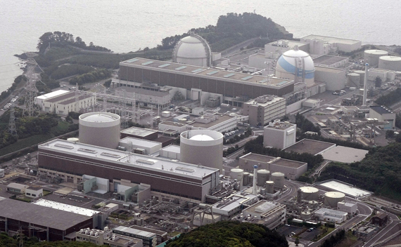An aerial view shows Kyushu Electric Power’s Genkai nuclear power plant, in Genkai town, Saga Prefecture, in this picture taken by Kyodo on June 9, 2011. The Japanese government moved closer on Wednesday to securing approval from local authorities to restart the first of 35 nuclear reactors shut for regular maintenance or kept idle since the March earthquake and tsunami. Japan’s trade and energy minister, undeterred by several dozen anti-nuclear protesters urging him to go home, tried to persuade local governments in the southern Saga prefecture that it was safe to restart nuclear reactors shut since a deadly natural disaster struck the country’s northeast on March 11.
