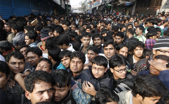 People gather in front of City Bank to buy tickets for the cricket World Cup in Dhaka on January 2, 2011. 