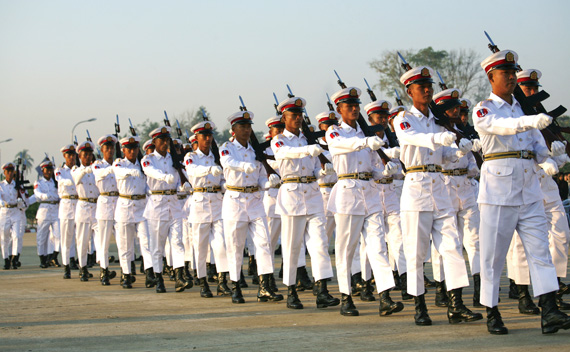 Soldiers march with their rifles during a ceremony to mark the 64th Myanmar Union Day in front of the City Hall in the new capital Naypyitaw February 12, 2011.