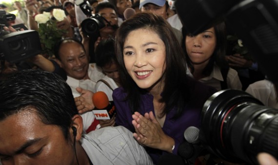 Yingluck Shinawatra, sister of ousted premier Thaksin Shinawatra, smiles as she arrives to her party’s headquarters after voting in general elections ended in Bangkok July 3, 2011.