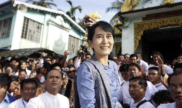 Aung San Suu Kyi, leader of Myanmar’s democratic opposition, smiles to supporters August 14, 2011.