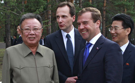 Russia’s President Dmitry Medvedev (R front) and North Korean leader Kim Jong-il (L) smile during their meeting at the