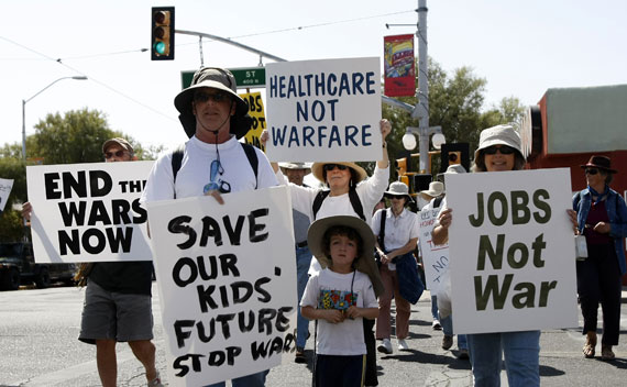 People protest in the streets regarding the United States’ actions in Libya, in Tucson, Arizona on March 19, 2011.