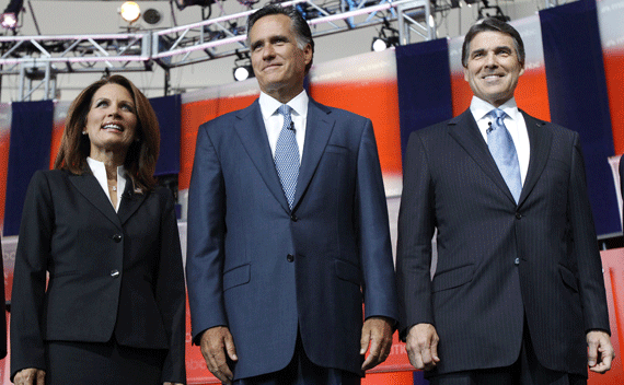 U.S. Republican presidential candidate, Rep. Michele Bachmann (R-MN), former Massachusetts Governor Mitt Romney (C) and Texas Governor Rick Perry stand on stage before the start of the Reagan Centennial GOP presidential primary debate at the Ronald Reagan Presidential Library in Simi Valley, California September 7, 2011. REUTERS/Mario Anzuoni