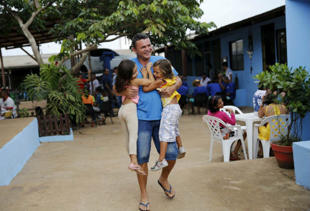 Enoque Lucio jokes with his children in Porto Velho, Rondonia State, Brazil August 28, 2015. In recent weeks, public outcry about high-profile cases of sexual violence have led to national debate about the rights of women and girls. REUTERS/Nacho Doce