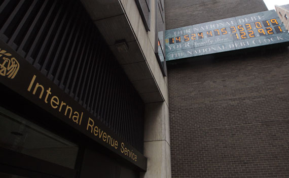 The National Debt Clock hangs on a wall next to an office for the Internal Revenue Service near Times Square in New York, May 16, 2011.