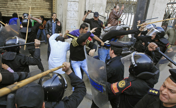 Riot police clash with protesters in Cairo January 26, 2011.