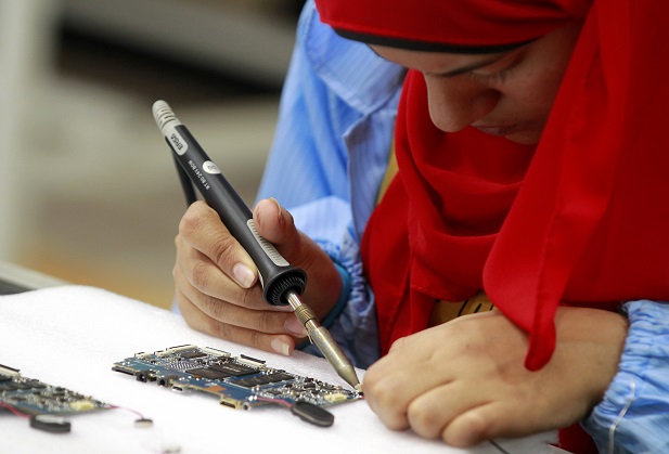 A worker is seen during manufacturing process for Egypt’s first tablet computer