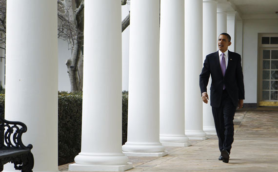 President Obama walks along the White House Colonnade today in Washington.