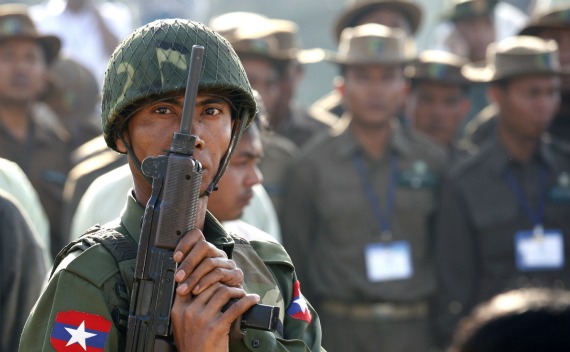 A soldier holds a gun during an opening ceremony of the Safari garden in the new capital Naypyitaw on February 12, 2011.