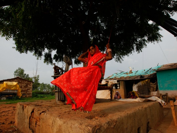 Child bride Krishna, 12, plays on an improvised swing outside her house in a village near Baran, India, July 2011 (Courtesy Reuters/Danish Siddiqui).