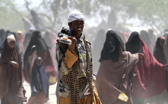 An al-Shabaab soldier carries his gun in southern Mogadishu on January 1, 2011 (Feisal Omar/Courtesy Reuters).