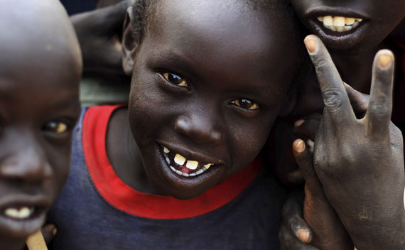 Young returnees from north Sudan smile in Aweil