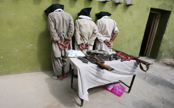 Three captured Taliban insurgents are presented to the media in Ghazni province on August 25, 2011 (Mustafa Andaleb/Courtesy Reuters).