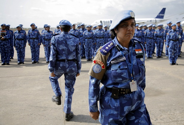 The first all-female unit of UN peacekeepers stand at attention as they arrive at Roberts International Airport outside Liberia’s capital Monrovia January 30, 2007. The group of more than 100 police women from India will stay in Liberia for six months, helping to train the local police force. REUTERS/Christopher Herwig (LIBERIA) - RTR1LTD2