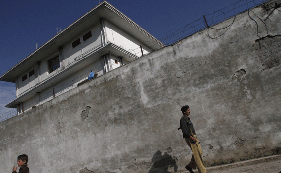 A policeman walks in front of the compound where al-Qaeda leader Osama bin Laden was killed in Abbottabad.