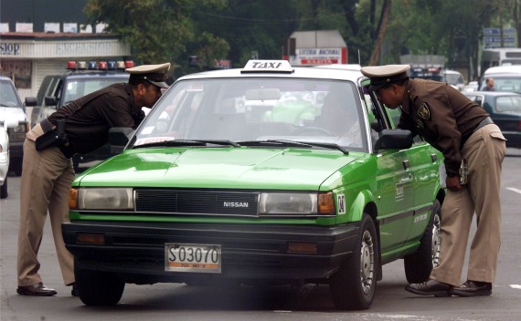 Mexico City traffic police inspect driving documents (Daniel Aguilar / Courtesy Reuters).