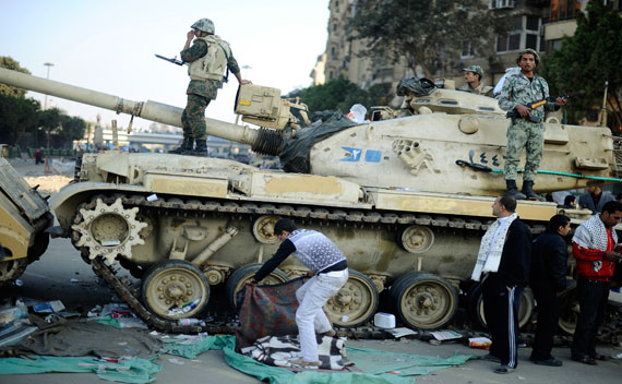 Egyptian soldiers chat as they stand on their tank before moving to another location at Tahrir Square in Cairo on February 12, 2011 (Dylan Martinez/Courtesy Reuters)