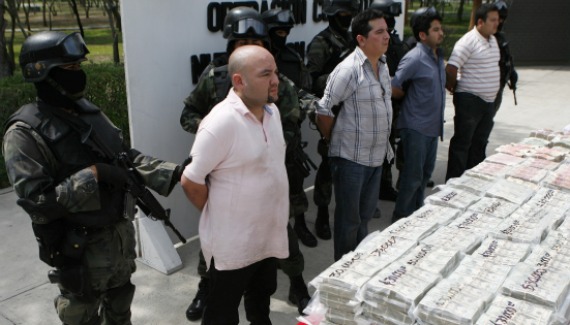 Soldiers escort four detainees for presentation to the media at a military zone on the outskirts of Monterrey (Tomas Bravo/Courtesy Reuters).