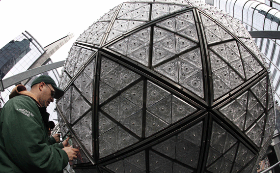 A worker installs some of the 288 new Waterford crystals, featuring this year’s ’Let There Be Friendship’ design, on the Times Square New Year’s Eve Ball atop One Times Square in New York December 27, 2011. Thousands are expected to pack Times Square on New Year’s Eve to watch the annual ball drop at midnight marking the beginning of 2012. REUTERS/Mike Segar