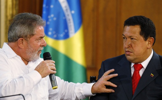 Venezuelan President Chavez looks on as his Brazilian counterpart Lula da Silva speaks during their meeting at Miraflores Palace in Caracas