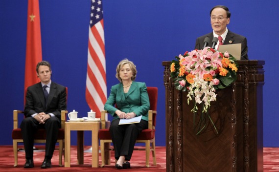 China’s Vice Premier Wang Qishan delivers a speech as U.S. Secretary of State Hillary Clinton and U.S. Treasury Secretary Timothy Geithner sit behind during the opening ceremony of the U.S.-China Strategic Economic Dialogue in Beijing in 2010.