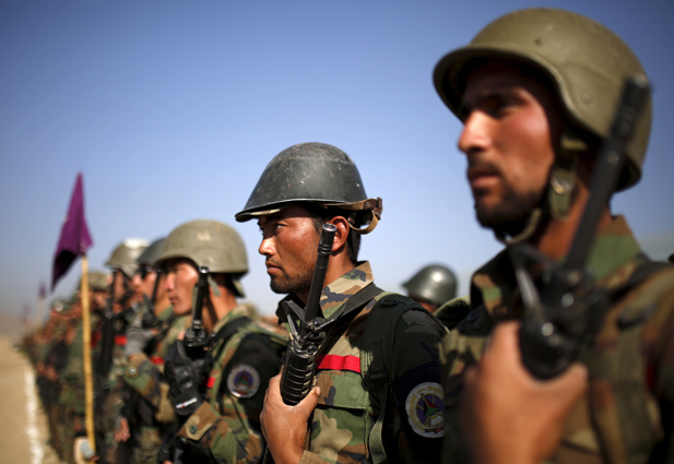 Afghan National Army (ANA) officers stand at attention during a training exercise at the Kabul Military Training Centre in Afghanistan
