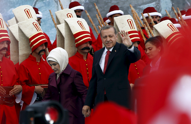 Turkish President Tayyip Erdogan, accompanied by his wife Emine Erdogan (L), greets his supporters as he arrives at the a ceremony to mark the 562nd anniversary of the conquest of the city by the Ottoman Turks, in Istanbul, Turkey, May 30, 2015.