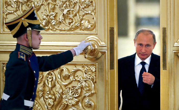 Russian President Vladimir Putin attends a meeting at the Kremlin. 