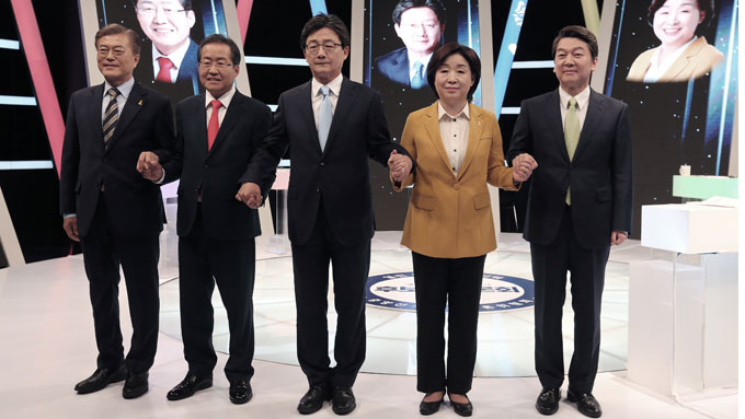 South Korea’s presidential candidates pose ahead of a televised debate, Seoul, May 2, 2017.