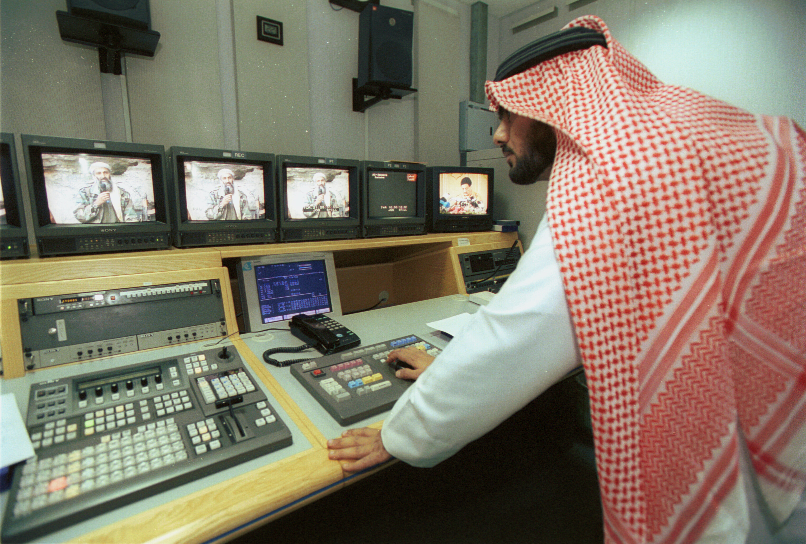 A news producer cuts tape of Osama bin Laden in October 2001.