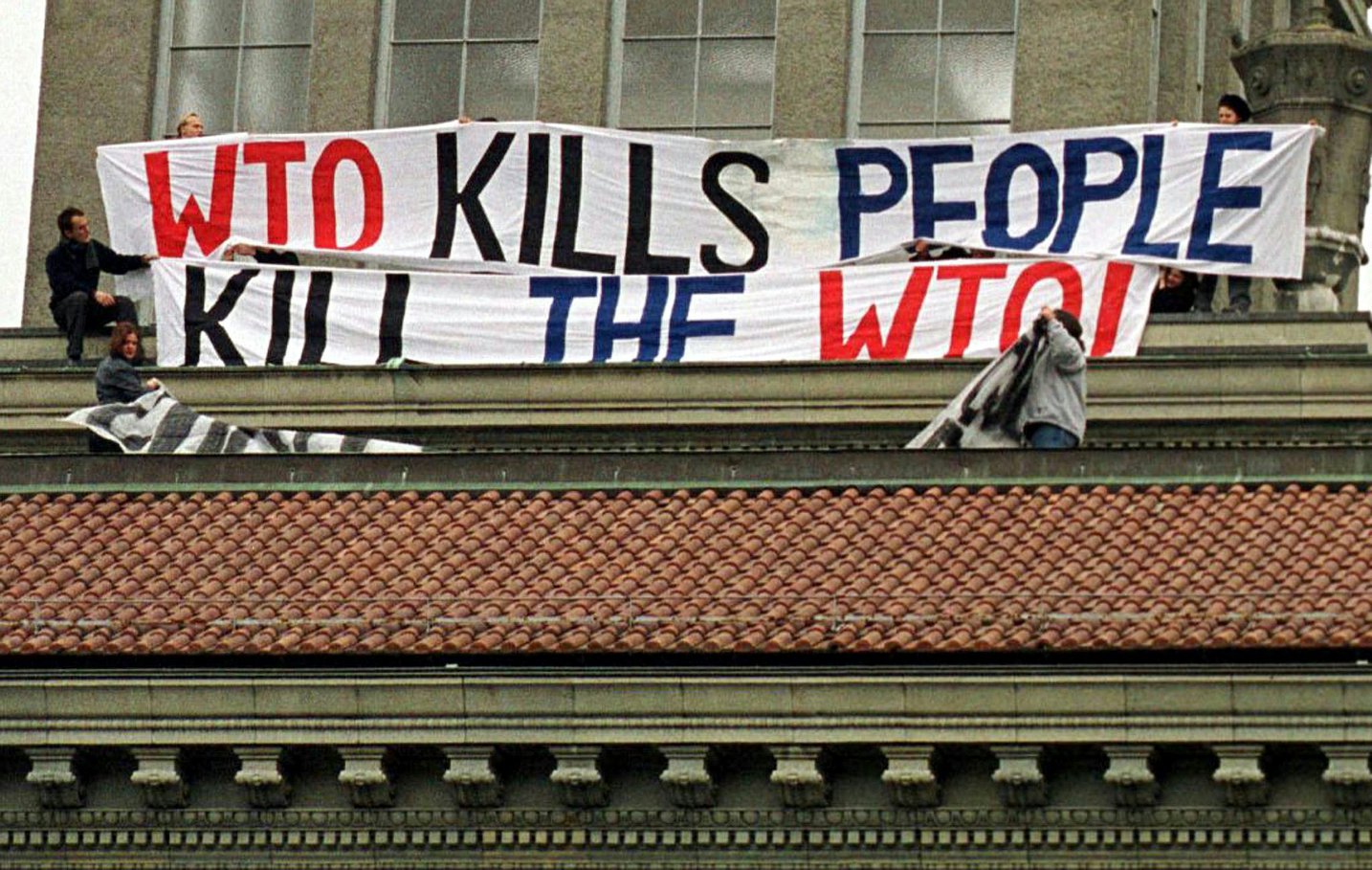Protestors on the roof of the World Trade Organization's (WTO) headquarters in Geneva.