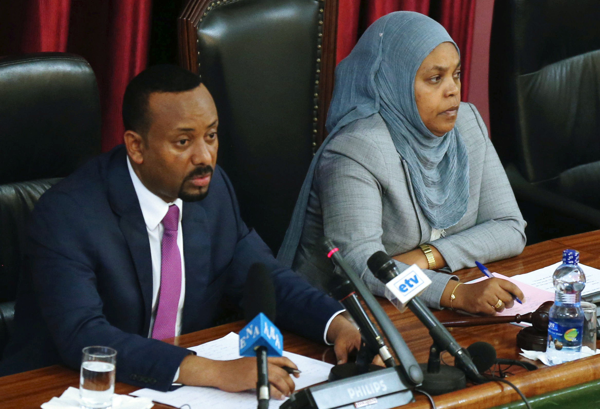 Ethiopia's Prime Minister Abiy Ahmed, and Muferiat Kamil, newly-named Minister of Peace, address members of parliament.