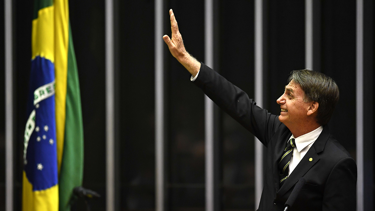 President-Elect Jair Bolsonaro waves inside the Congress building in the capital, Brasilia.