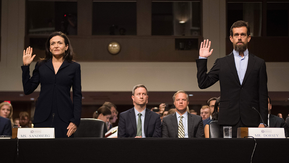 CEO of Twitter Jack Dorsey and Facebook COO Sheryl Sandberg are sworn in to testify before the Senate Intelligence Committee on Capitol Hill in Washington, DC, on September 5, 2018. 