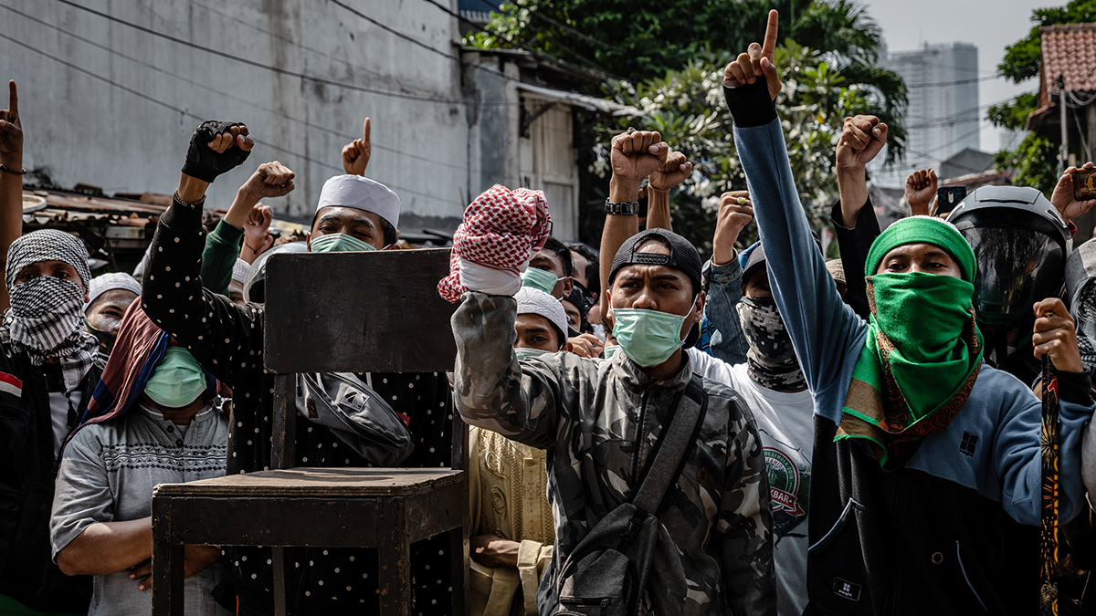 Protesters shout during a demonstration in Jakarta after official election results were announced.