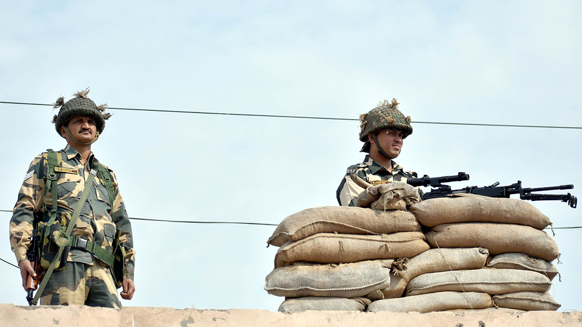 Security personnel stand guard near the Attari-Wagah border crossing.