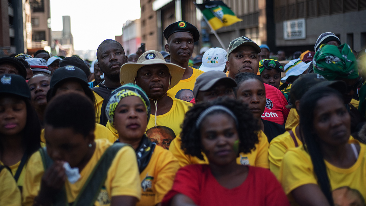 African National Congress supporters listen to President Cyril Ramaphosa during an election victory rally in Johannesburg.