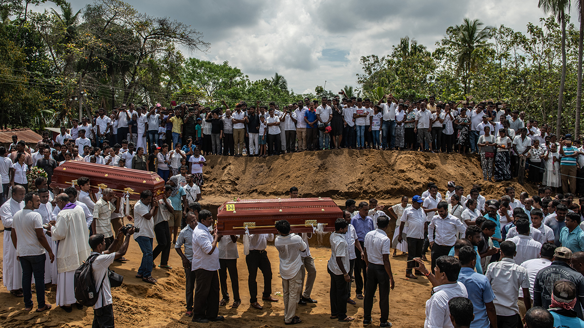 Mourners carry the coffins of victims of the Sri Lanka bombings in April. 