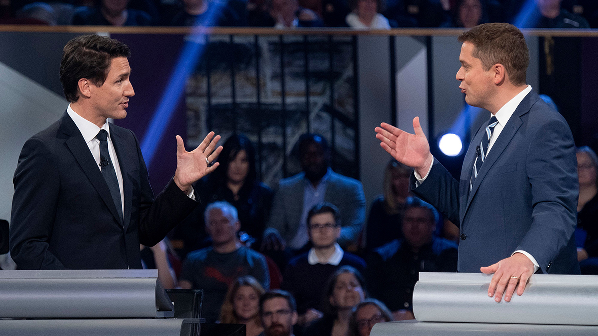 Canadian Prime Minister Justin Trudeau and Conservative Party leader Andrew Scheer debate each other.