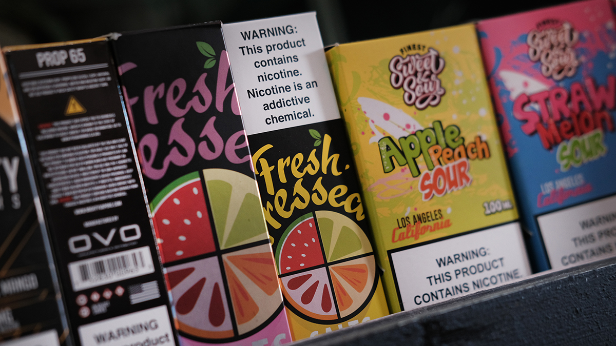 Vaping products, including flavored vape liquids and pods, are displayed at a shop in Queens, New York City.